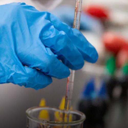 How is Triflic Anhydride Produced by Reacting Triflic Acid with Carboxylic Acid Chlorides?